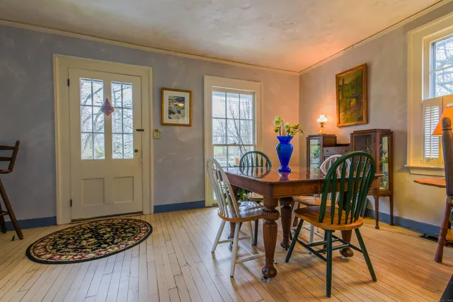 a dining room with furniture and window