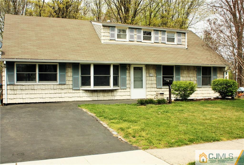 33 Ashley Road Edison, NJ 08817 - Photo 1 of 20 a front view of a house with a garden