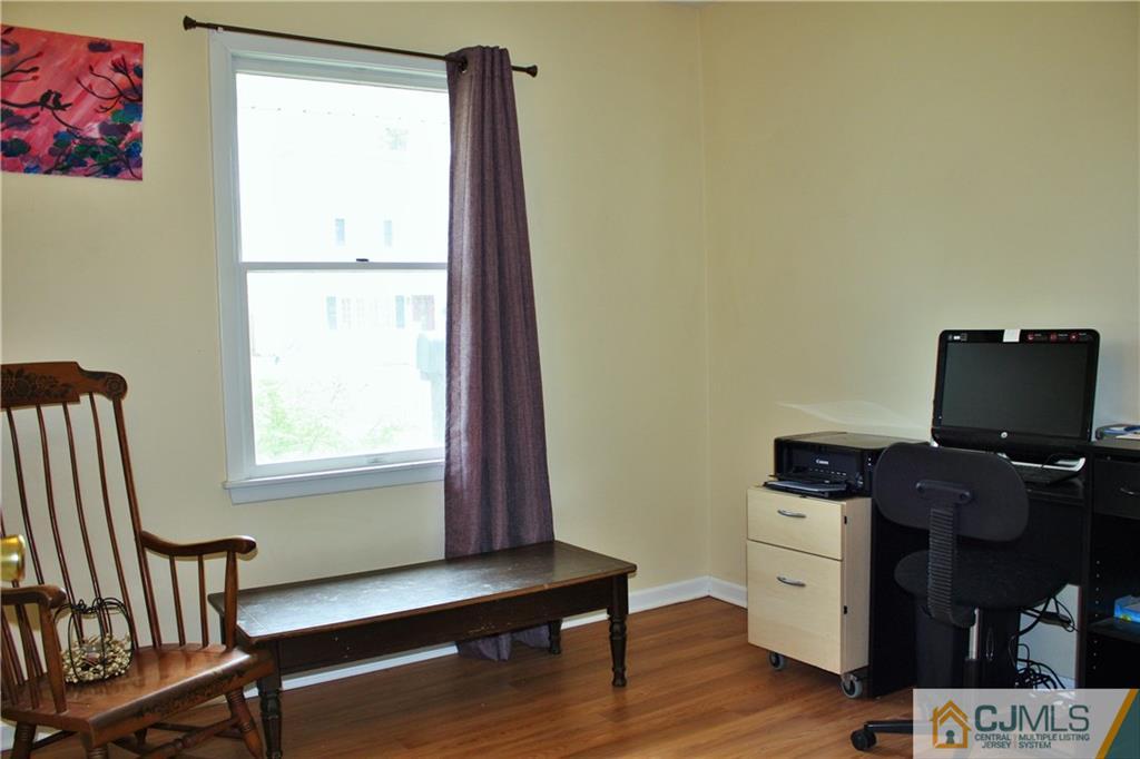 33 Ashley Road Edison, NJ 08817 - Photo 14 of 20 a view of workspace with wooden floor outdoor seating
