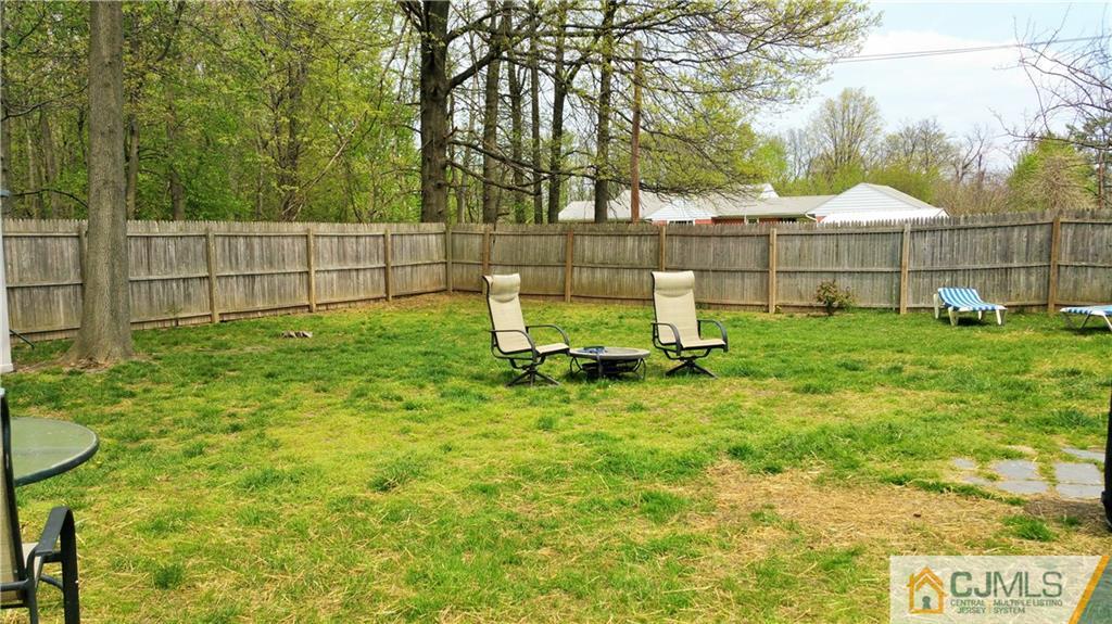33 Ashley Road Edison, NJ 08817 - Photo 20 of 20 a view of backyard with wooden fence