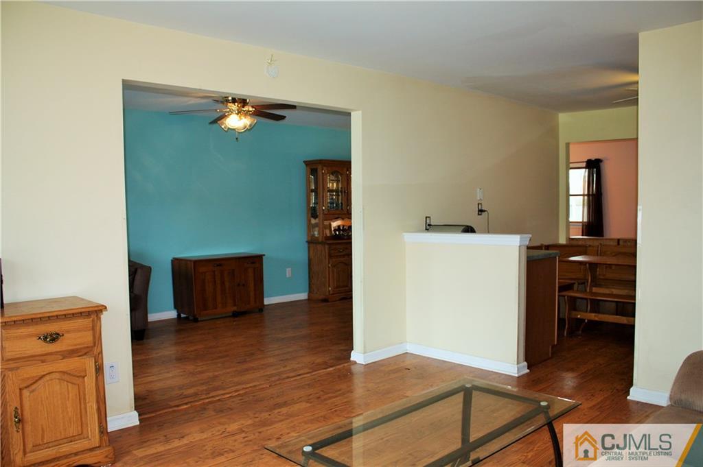 33 Ashley Road Edison, NJ 08817 - Photo 3 of 20 a view of a room with wooden floor and cabinet