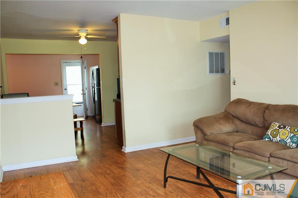 33 Ashley Road Edison, NJ 08817 - Photo 4 of 20 a living room with furniture and a wooden floor