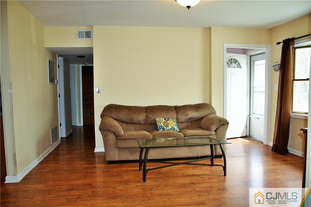 33 Ashley Road Edison, NJ 08817 - Photo 5 of 20 a living room with furniture and a wooden floor