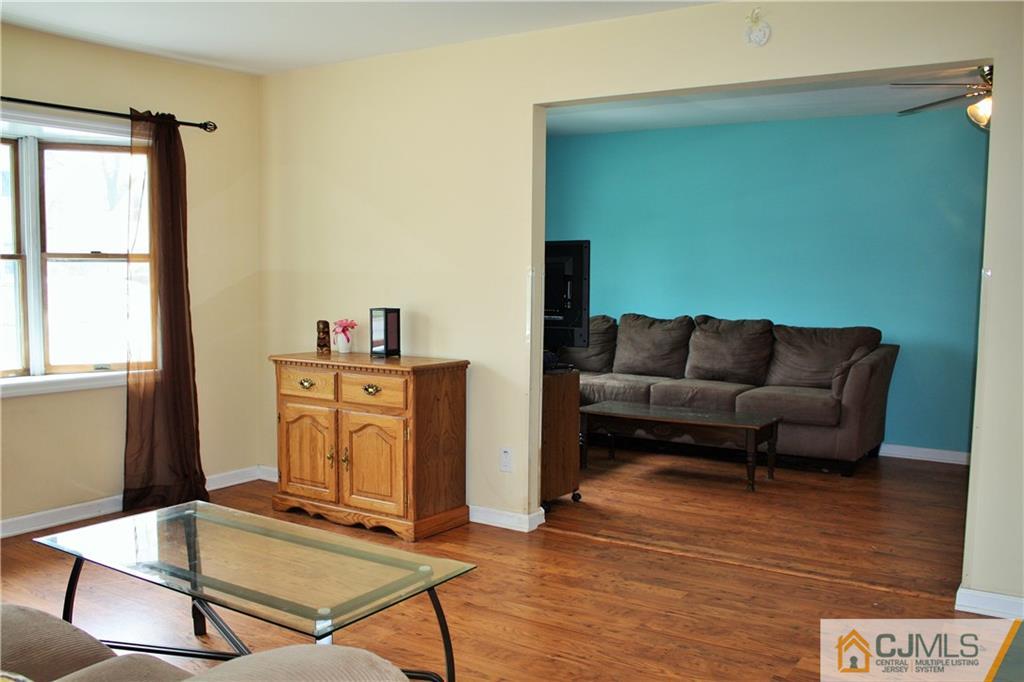 33 Ashley Road Edison, NJ 08817 - Photo 6 of 20 a living room with furniture and wooden floor