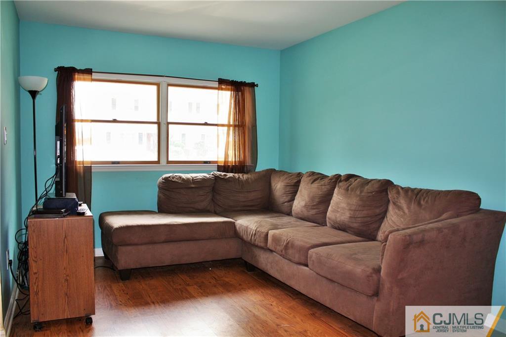 33 Ashley Road Edison, NJ 08817 - Photo 7 of 20 a living room with furniture and a window