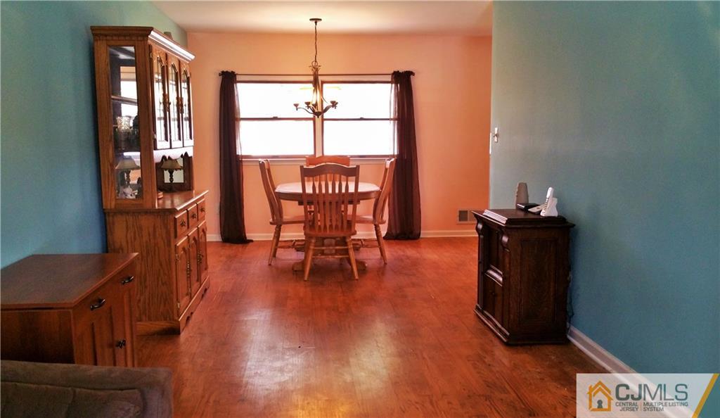 33 Ashley Road Edison, NJ 08817 - Photo 9 of 20 a dining room with furniture and wooden floor