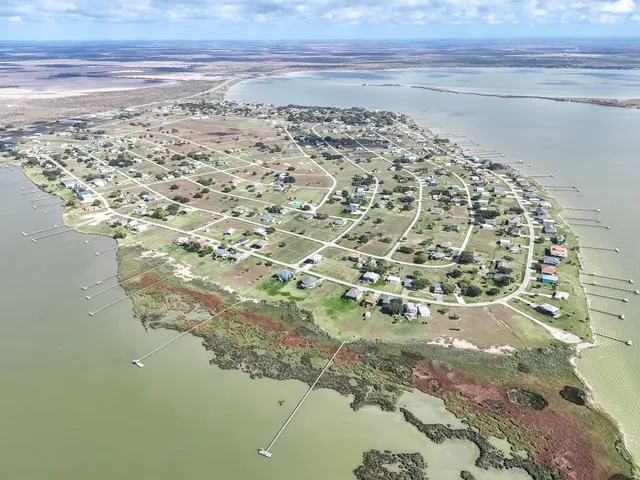 a view of a swimming pool with a yard