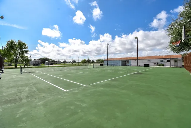 a garden with a table and a chairs