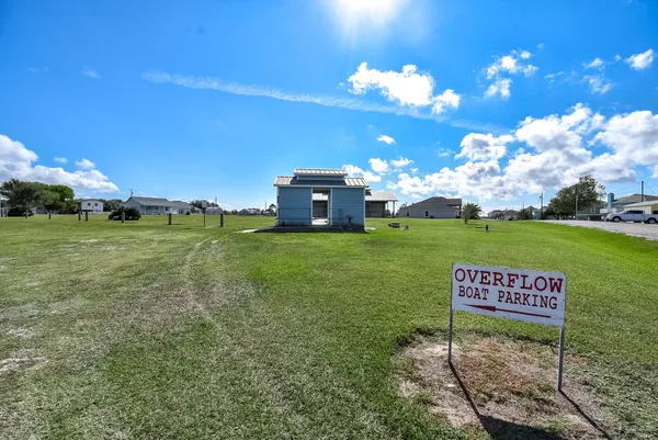 a view of balcony with wooden floor and seating space