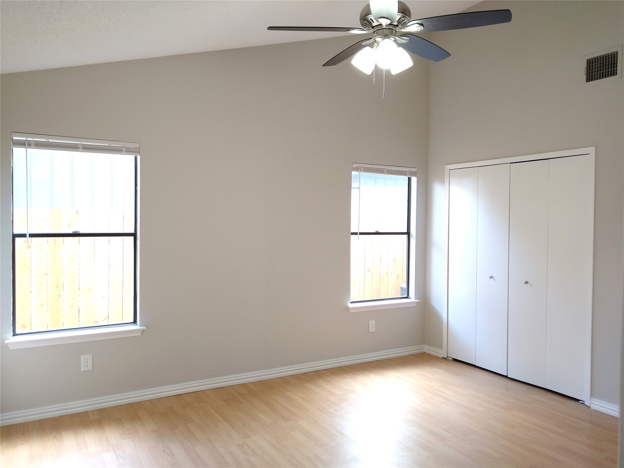 1813 Laurel Path Round Rock, TX 78664 - Photo 26 of 35 A generous bedroom with vaulted ceilings and wood-look flooring awaits your personal touches.