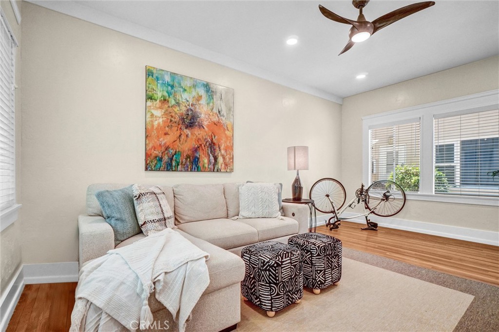 1616 East Ocean Boulevard, Unit 6 Long Beach, CA 90802 - Photo 11 of 37 a living room with furniture a couch and paintings on the wall