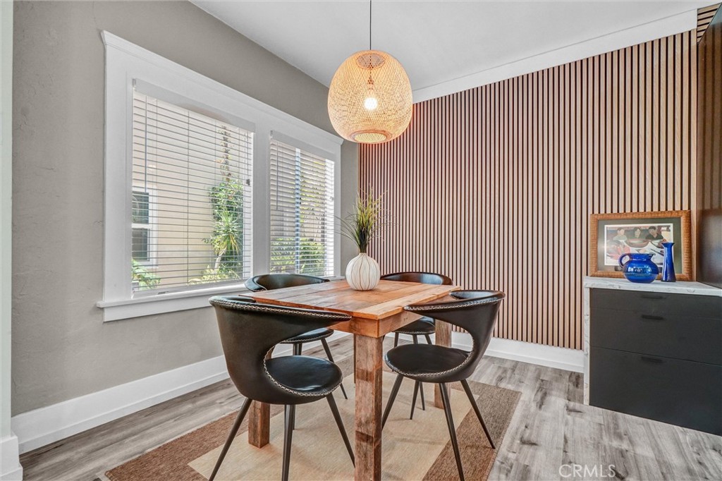 1616 East Ocean Boulevard, Unit 6 Long Beach, CA 90802 - Photo 13 of 37 a view of a dining room with furniture and wooden floor
