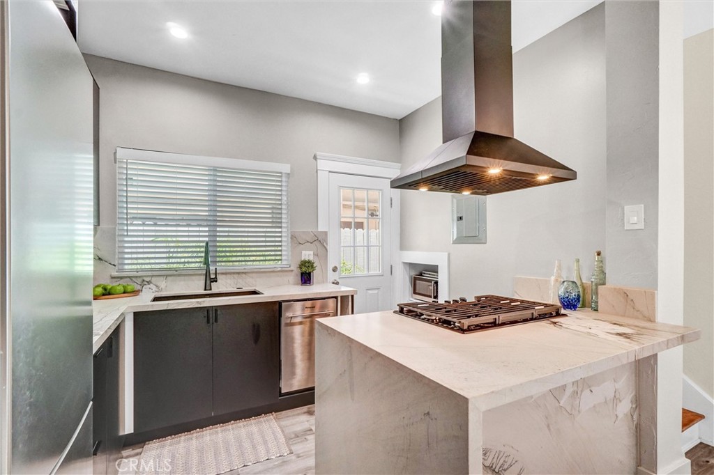1616 East Ocean Boulevard, Unit 6 Long Beach, CA 90802 - Photo 15 of 37 a kitchen with a sink a stove and a refrigerator