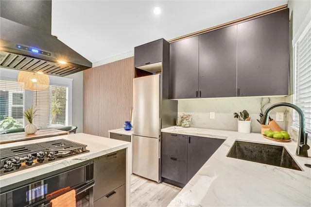 a kitchen with a stove and a sink