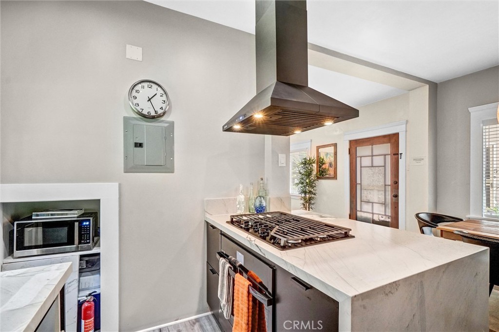 1616 East Ocean Boulevard, Unit 6 Long Beach, CA 90802 - Photo 18 of 37 a kitchen with a stove and a microwave