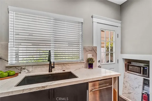 a kitchen with a sink and a window