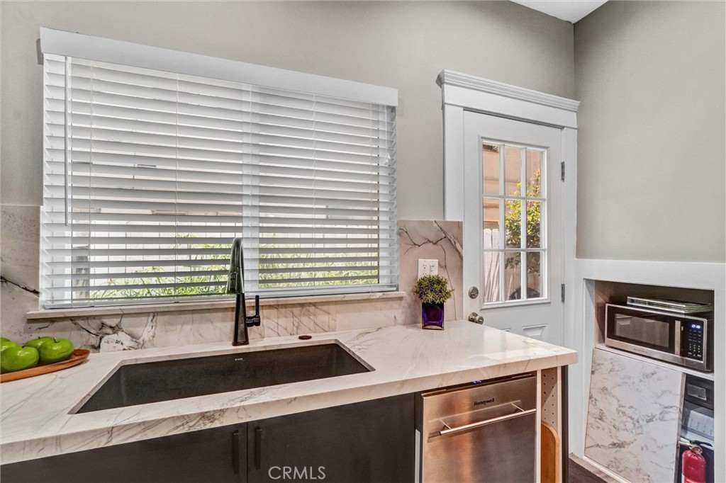 1616 East Ocean Boulevard, Unit 6 Long Beach, CA 90802 - Photo 19 of 37 a kitchen with a sink and a window
