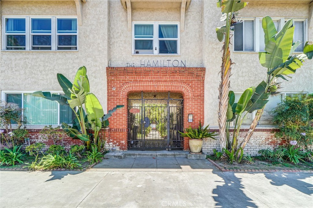 1616 East Ocean Boulevard, Unit 6 Long Beach, CA 90802 - Photo 2 of 37 a front view of a house with a garden