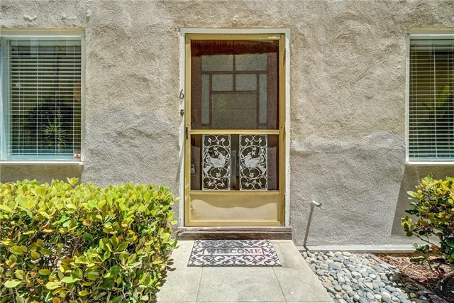 a front view of a house with a gate