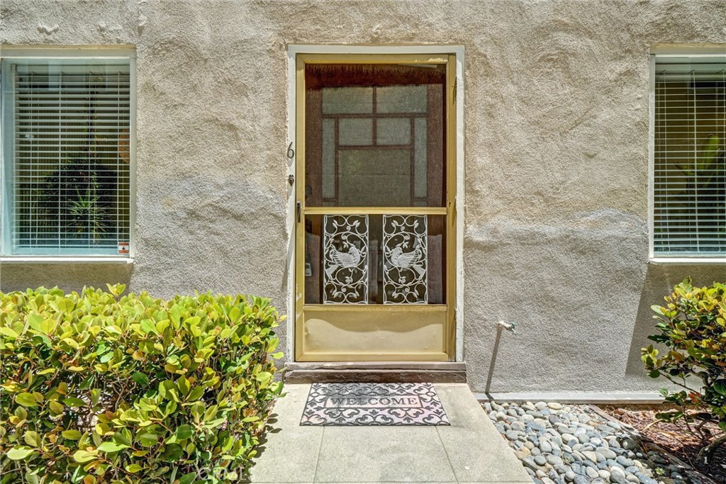 1616 East Ocean Boulevard, Unit 6 Long Beach, CA 90802 - Photo 6 of 37 a front view of a house with a gate