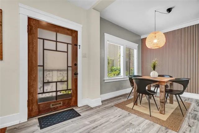a view of a dining room with furniture and window