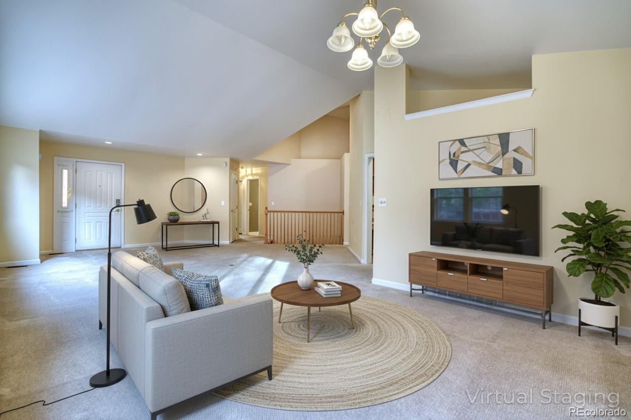 756 Brookside Drive Longmont, CO 80504 - Photo 11 of 46 a living room with furniture and a flat screen tv