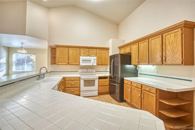 a kitchen with a sink and a microwave