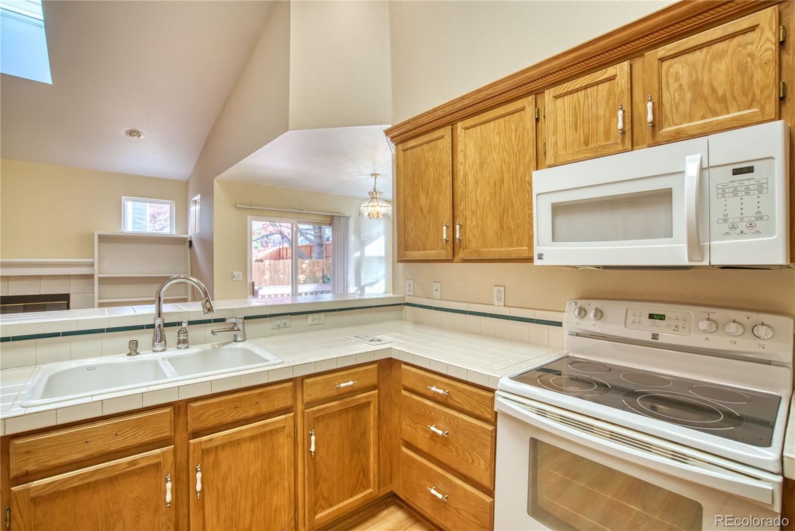 756 Brookside Drive Longmont, CO 80504 - Photo 19 of 46 a kitchen with a sink and a microwave