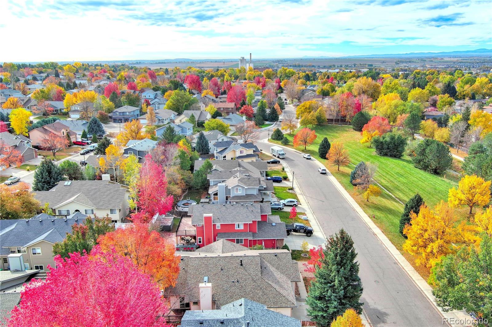 756 Brookside Drive Longmont, CO 80504 - Photo 2 of 46 a view of yard and swimming pool