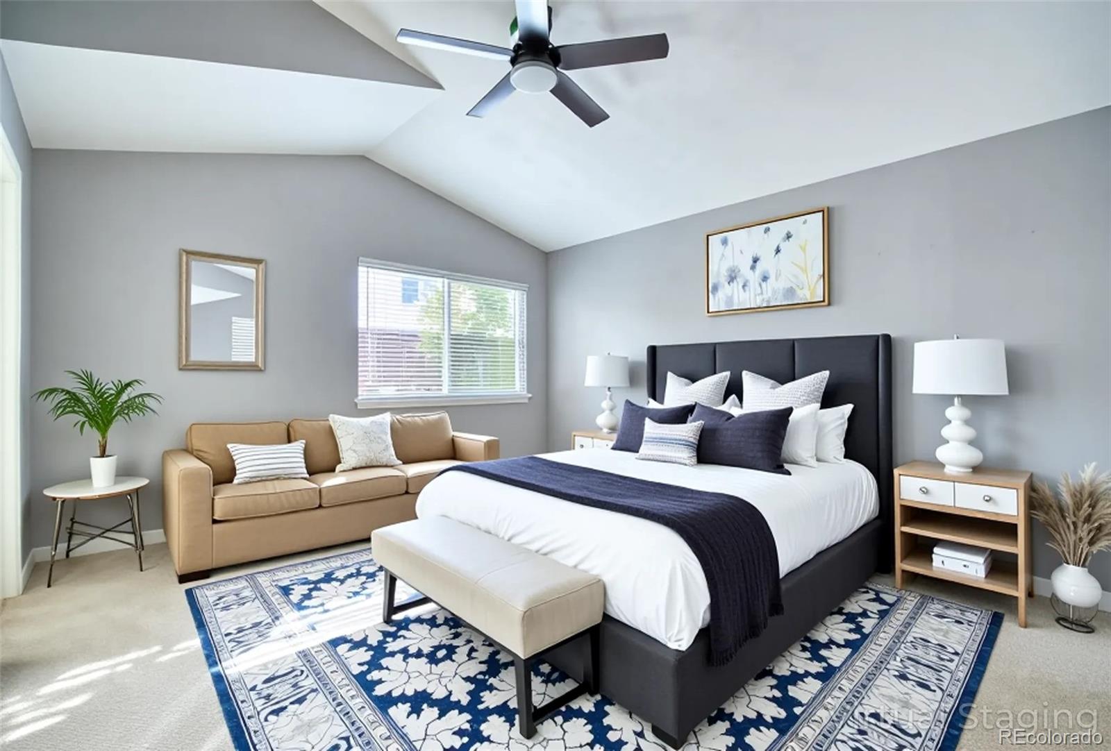 756 Brookside Drive Longmont, CO 80504 - Photo 21 of 46 a bedroom with a large bed and a couch