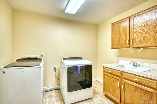 a bathroom with a sink mirror vanity and toilet