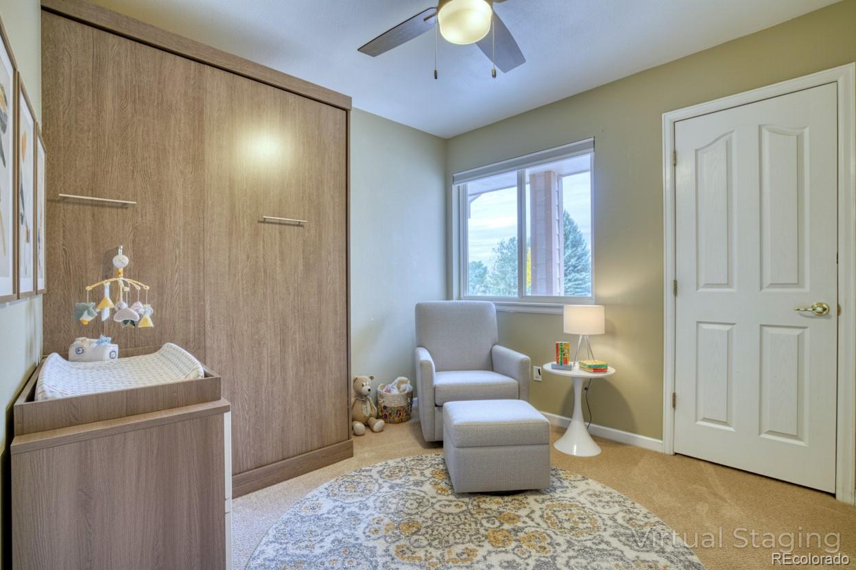 756 Brookside Drive Longmont, CO 80504 - Photo 29 of 46 a living room with furniture and a window