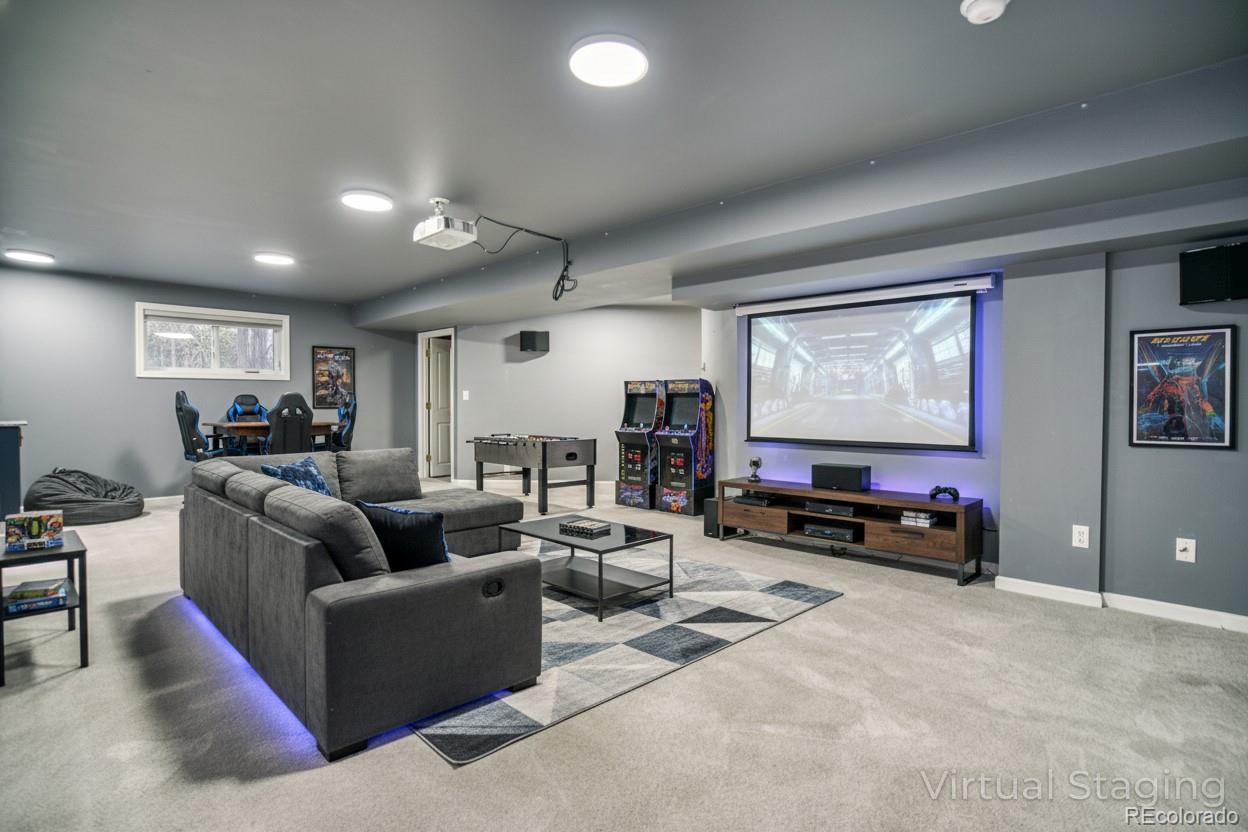 756 Brookside Drive Longmont, CO 80504 - Photo 35 of 46 a living room with furniture and a flat screen tv