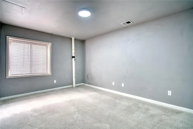 a bedroom with a bed a couch and a couch