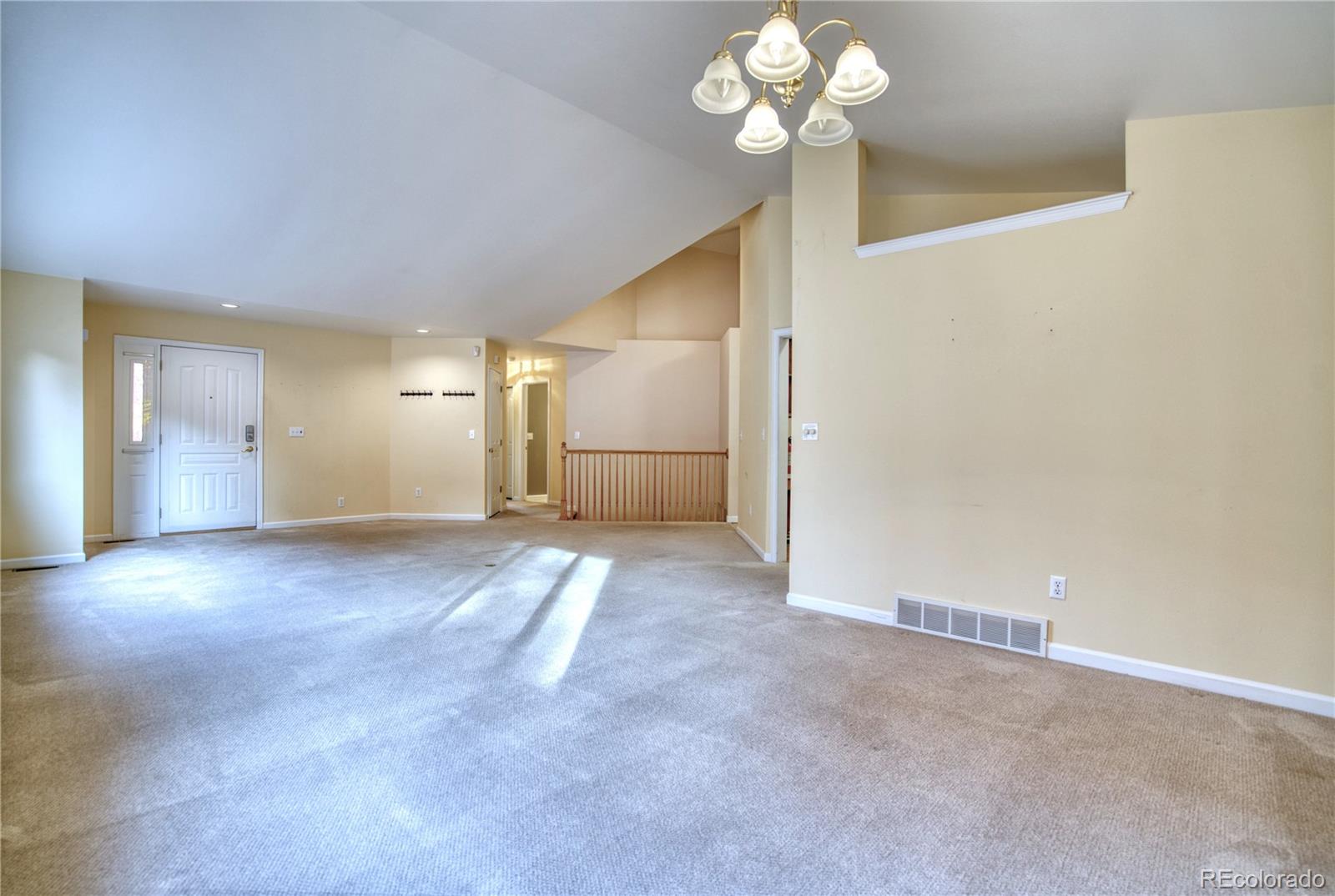 756 Brookside Drive Longmont, CO 80504 - Photo 10 of 46 a view of a room with a chandelier