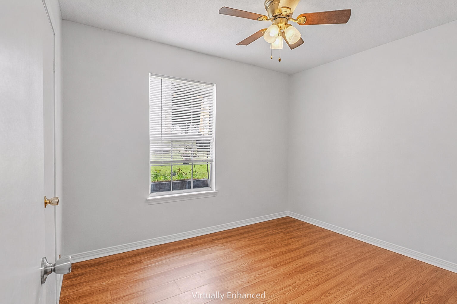 2880 Aplin Road Crestview, FL 32539 - Photo 19 of 33 an empty room with a window and a ceiling fan