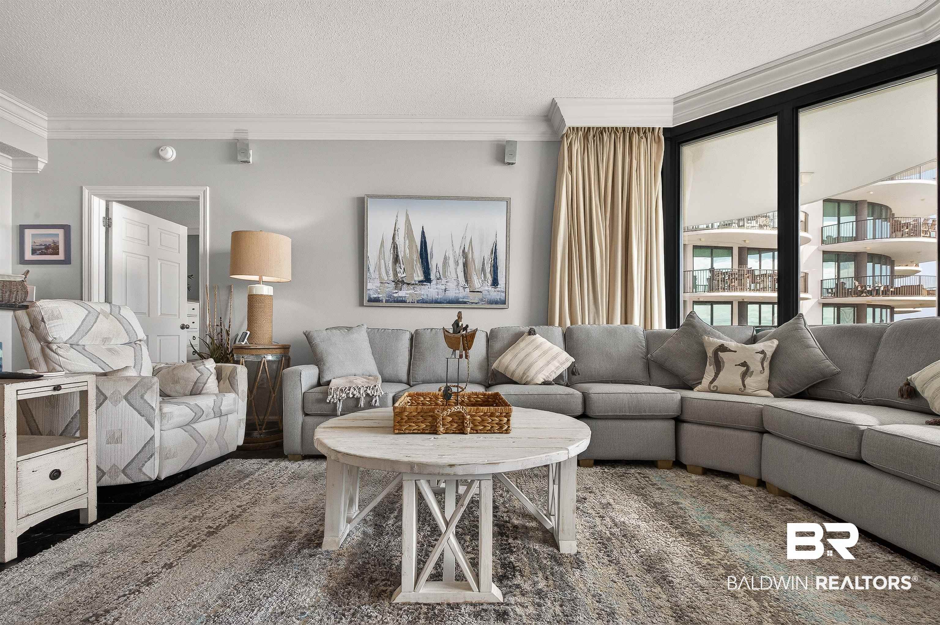 27582 Canal Road, Unit 2507 Orange Beach, AL 36561 - Photo 17 of 75 Living room featuring a textured ceiling and ornamental molding