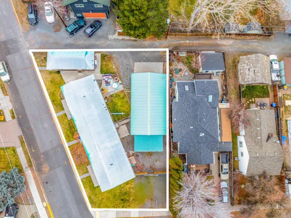 an aerial view of a house with a swimming pool