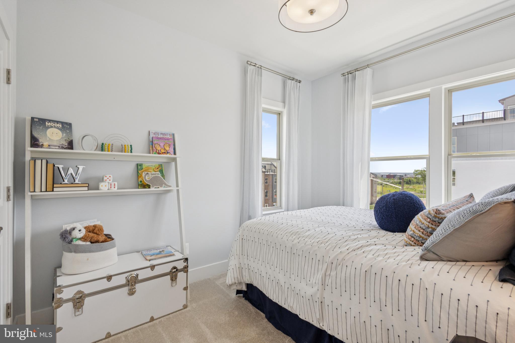 3807 Shale Ridge Road Woodbridge, VA 22193 - Photo 13 of 23 a bedroom with a bed a window and storage