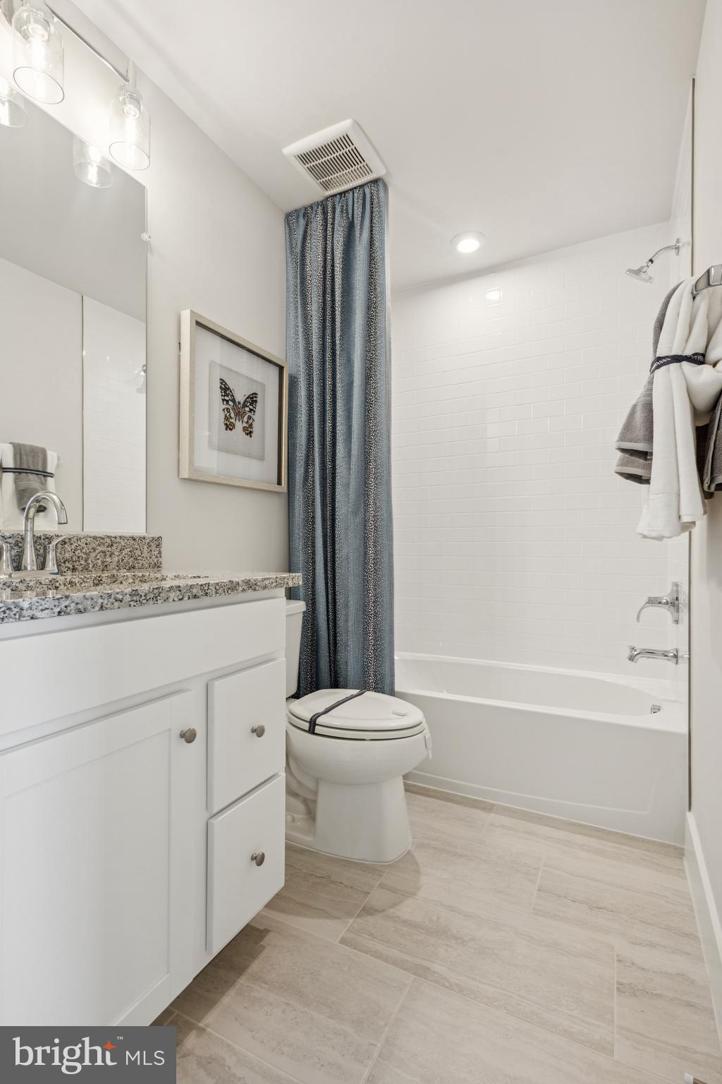 3807 Shale Ridge Road Woodbridge, VA 22193 - Photo 15 of 23 a bathroom with a granite countertop sink toilet and shower