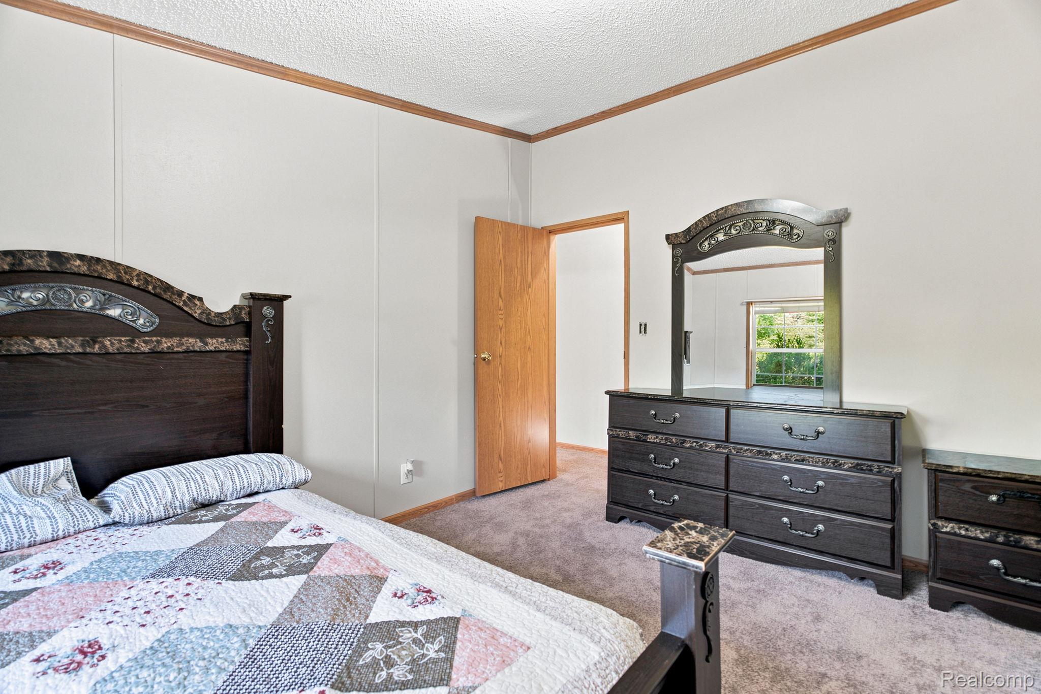 2390 Lakeshore Road Applegate, MI 48401 - Photo 72 of 97 Carpeted flooring, paneled walls, and wood-finish trim