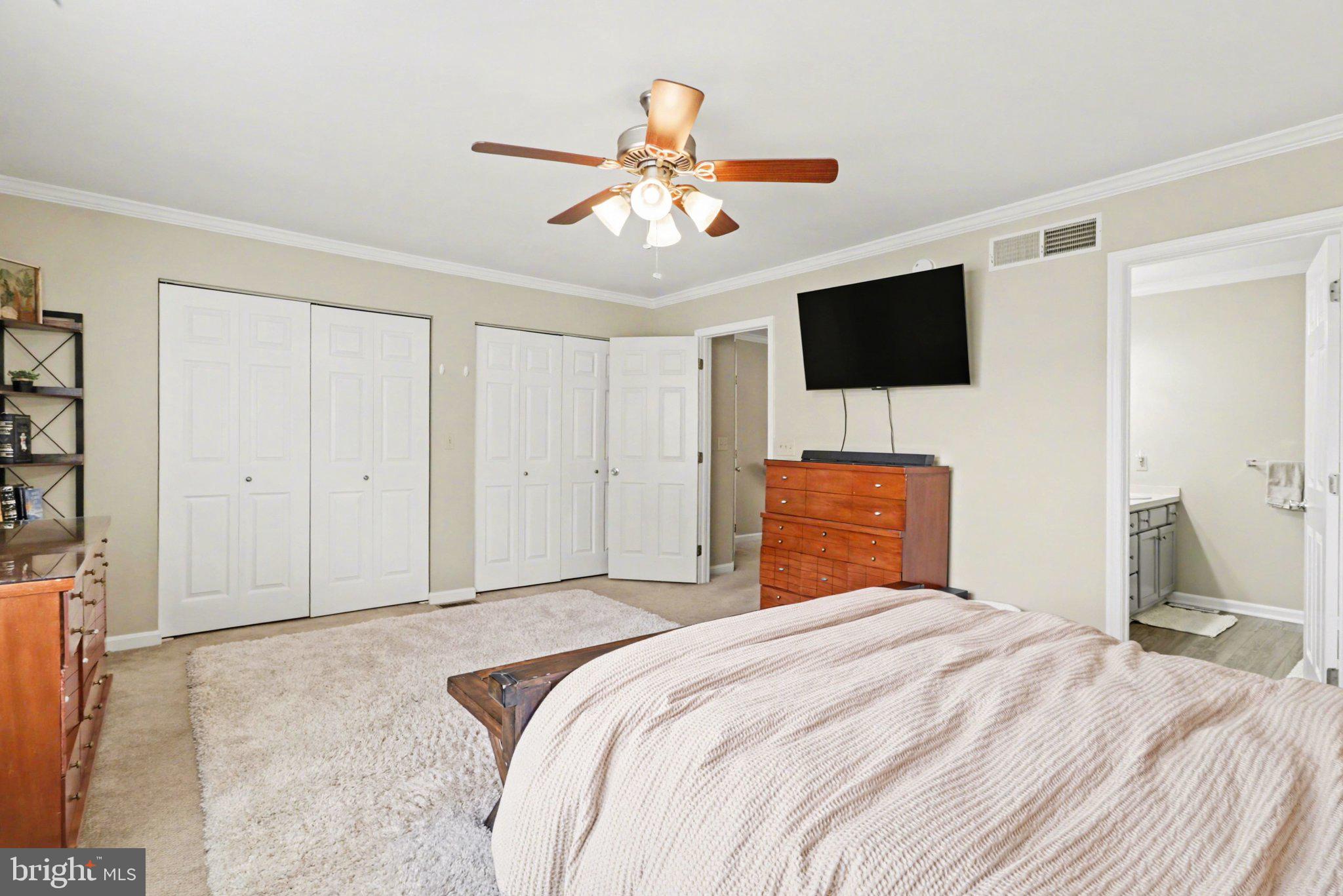 652 Springhouse Lane Hummelstown, PA 17036 - Photo 13 of 35 a bedroom with a bed and a flat screen tv