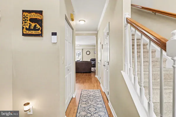 a view of a hallway with paintings on the wall