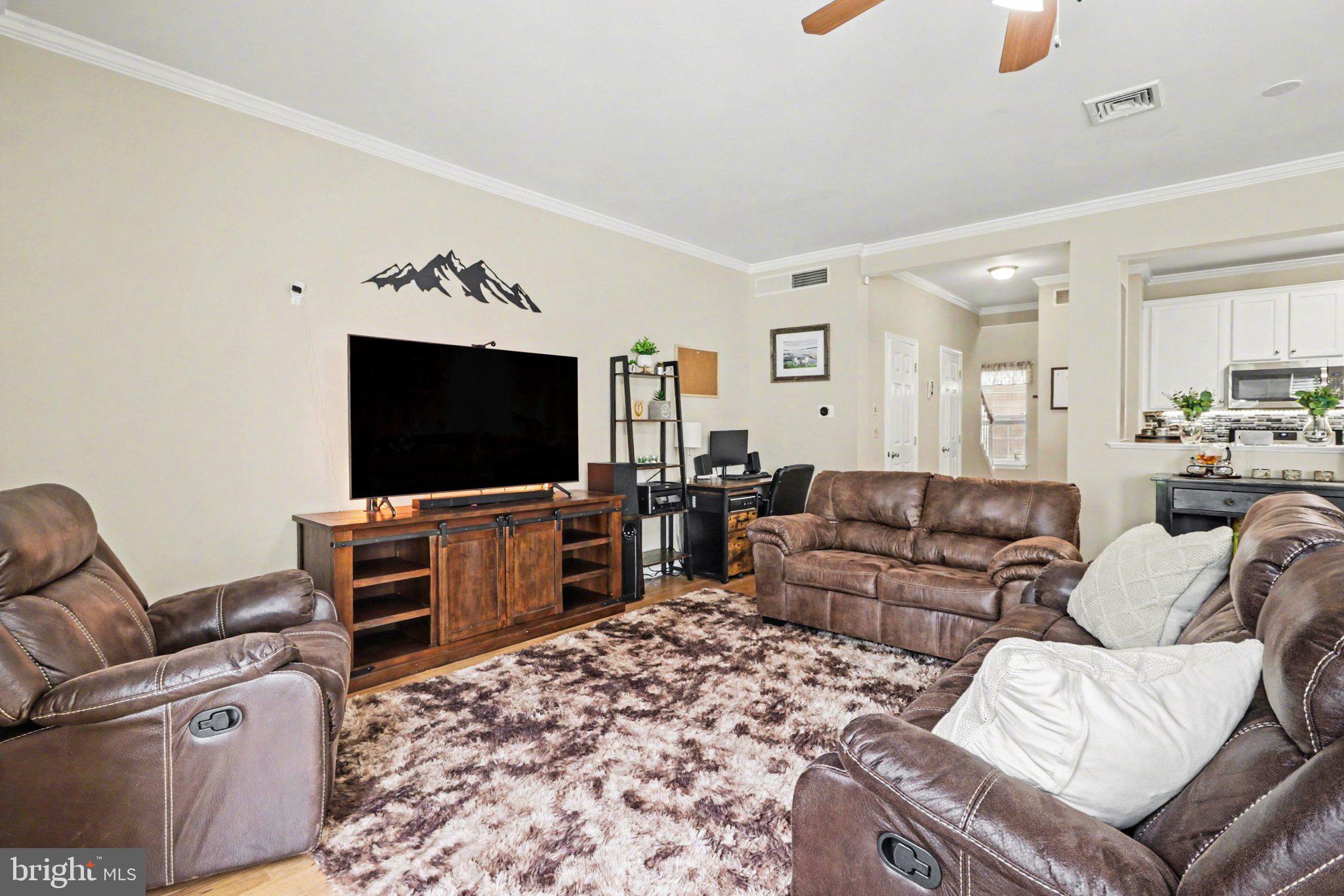 652 Springhouse Lane Hummelstown, PA 17036 - Photo 2 of 35 a living room with furniture and a flat screen tv
