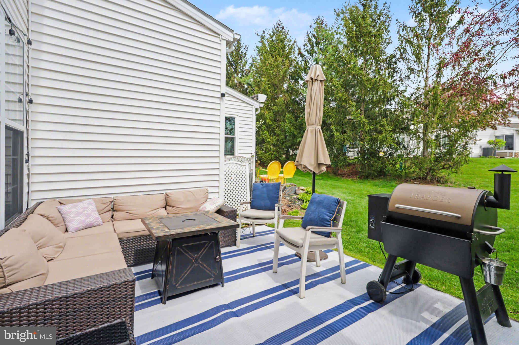 652 Springhouse Lane Hummelstown, PA 17036 - Photo 25 of 35 a view of a patio with table and chairs and potted plants