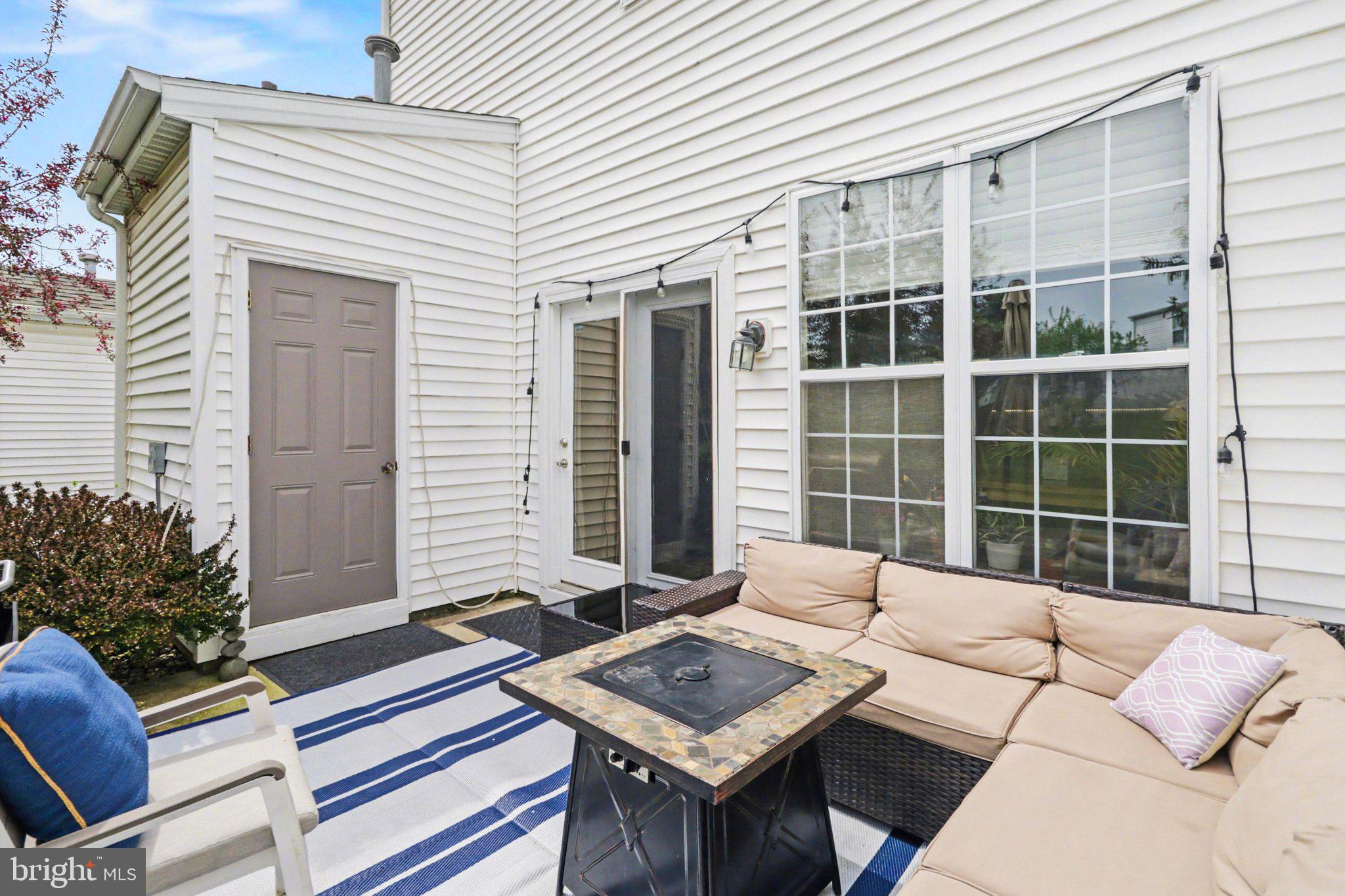 652 Springhouse Lane Hummelstown, PA 17036 - Photo 26 of 35 a view of a patio with a table and chairs