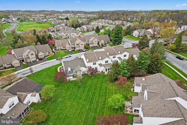 an aerial view of a house with a garden