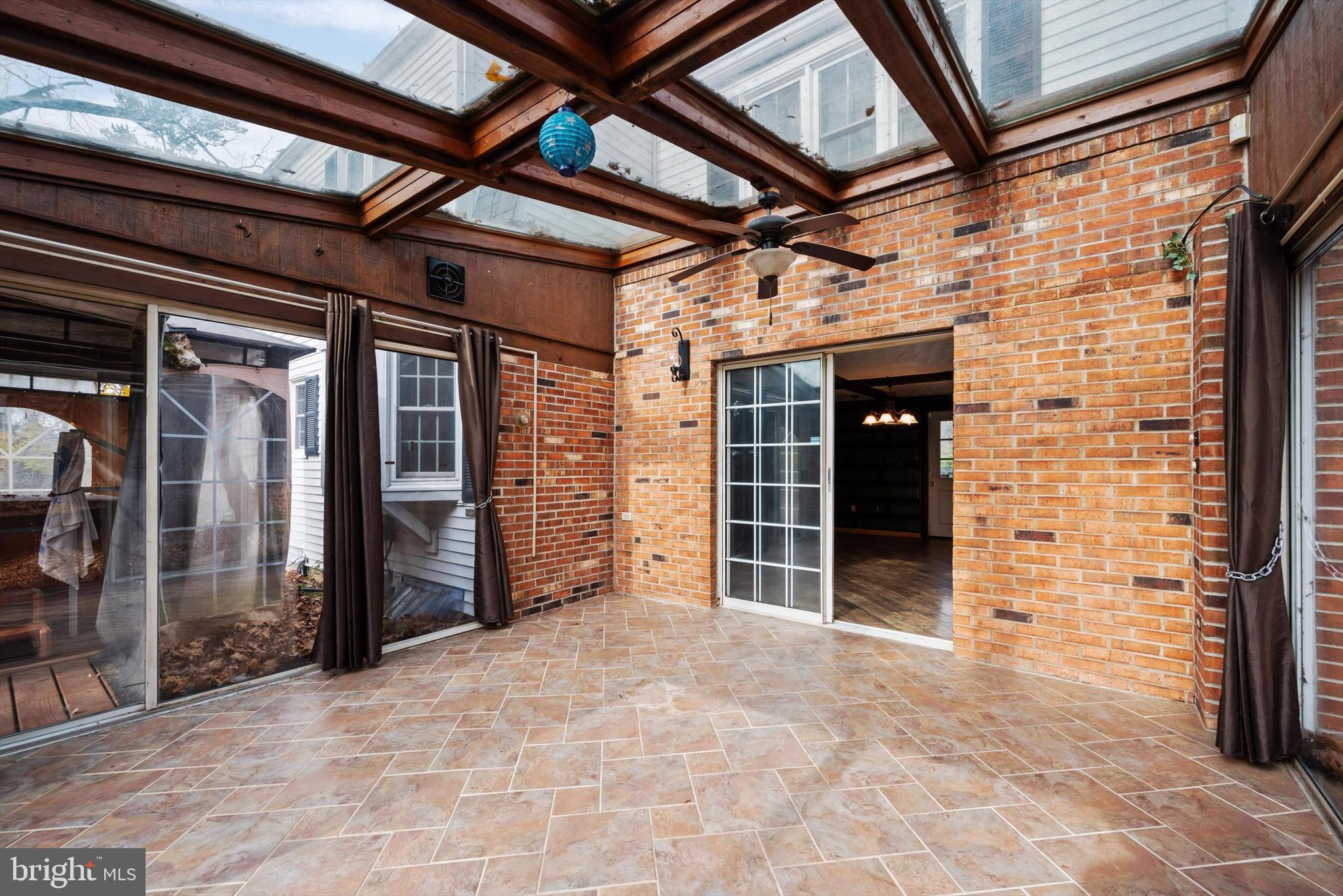 6953 Middle Road Middletown, VA 22645 - Photo 23 of 56 sunroom with access to hot tub