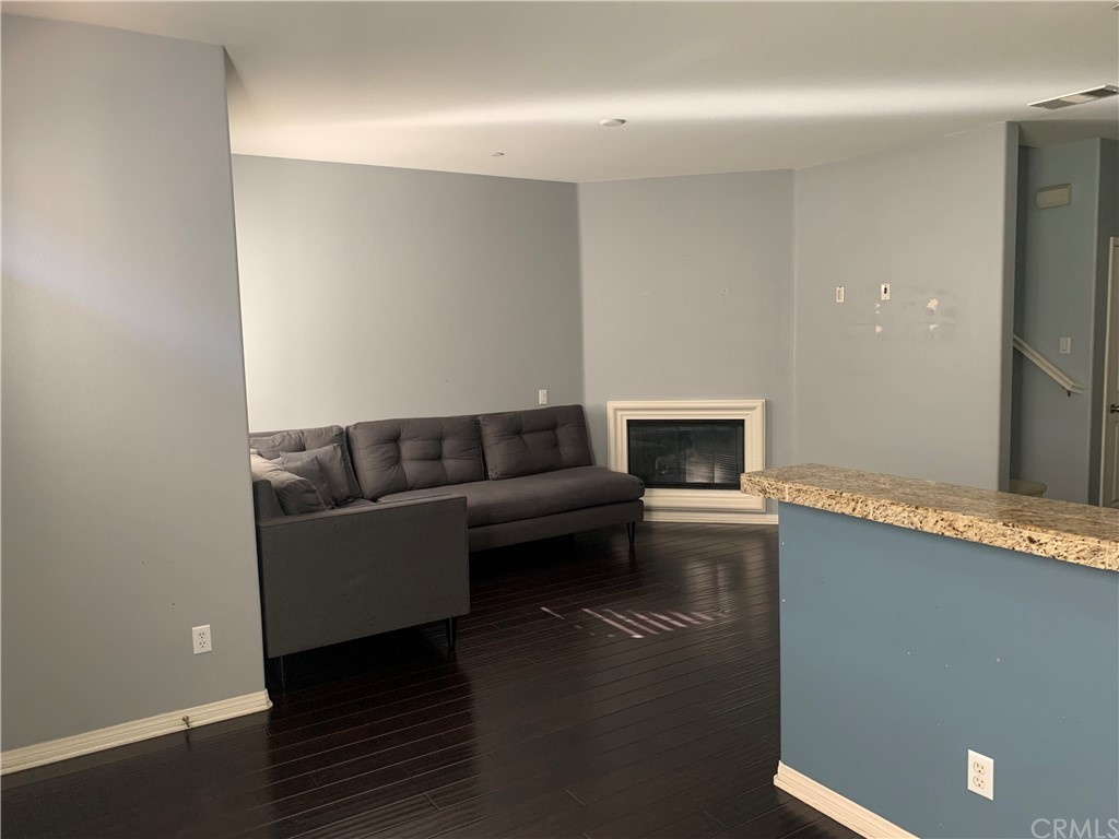 336 West Linden Drive Orange, CA 92865 - Photo 8 of 21 a living room with furniture and a fireplace