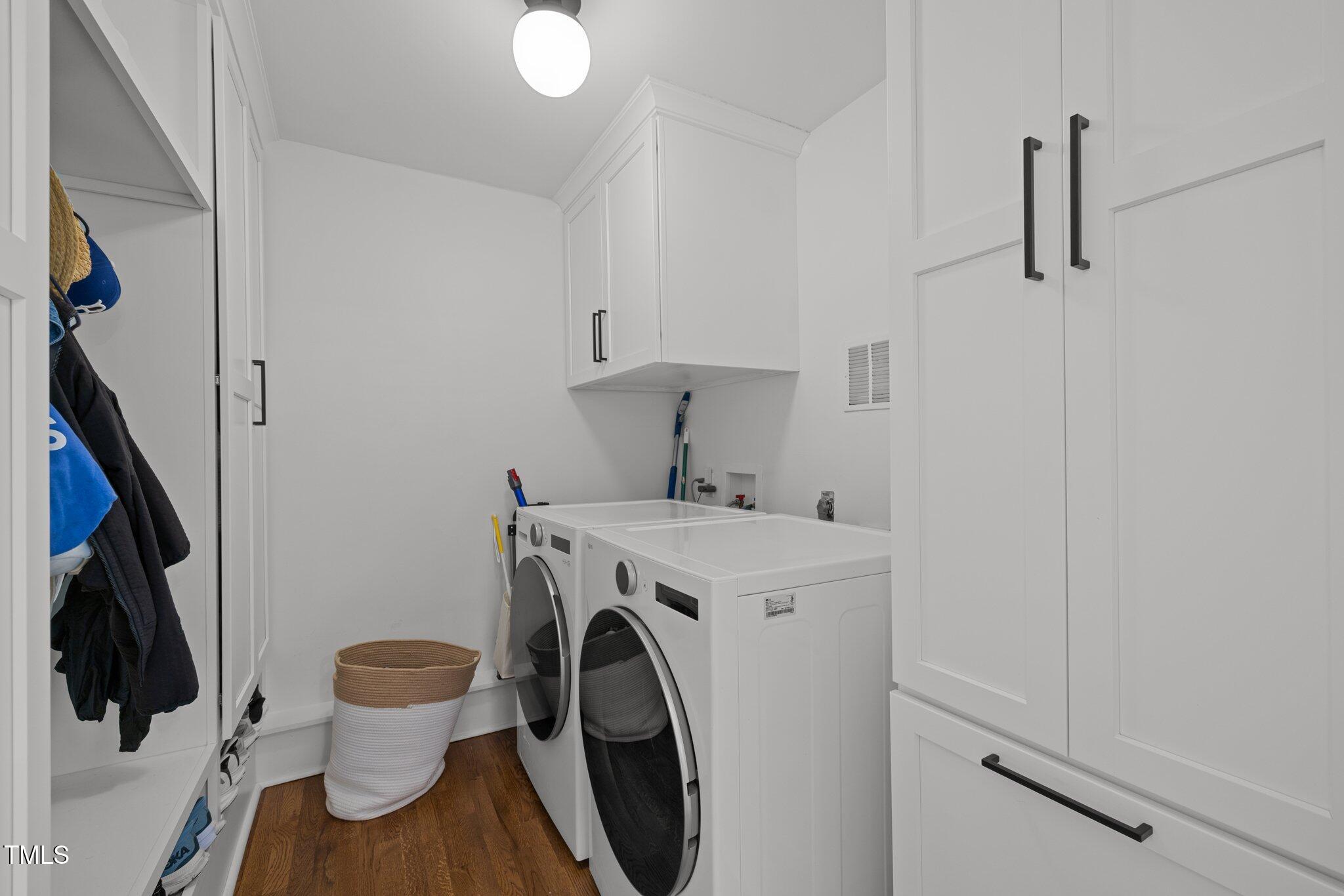 1706 Rangecrest Road Raleigh, NC 27612 - Photo 16 of 43 a view of a storage and utility room with washer and dryer